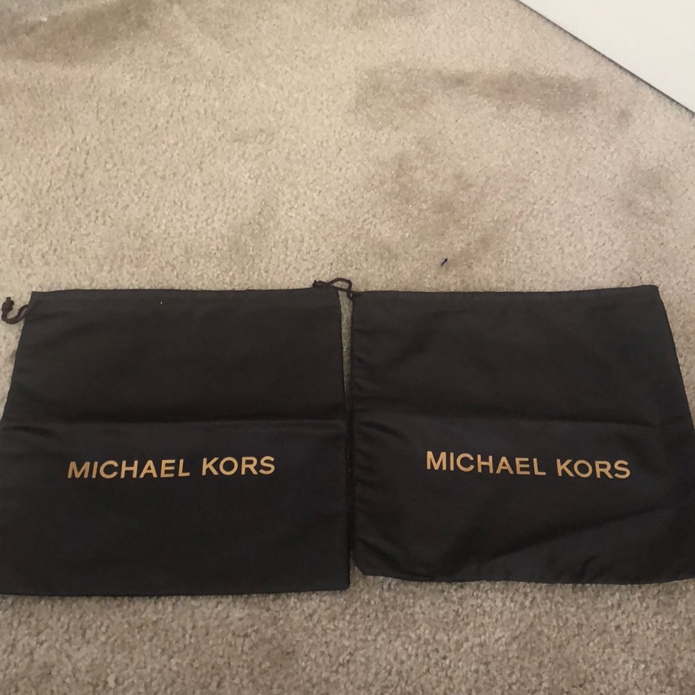 2 chocolate brown Michael Kors pouches